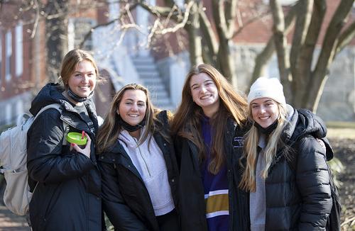 A group of students pose for a picture on campus