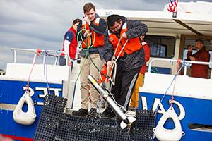 Students working on a boat